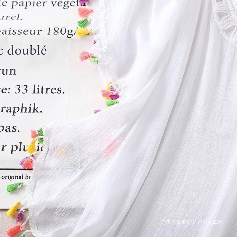 Cross-border new holiday hook solid color stitching European and American beach skirt small tassel sunscreen short sexy beach blouse