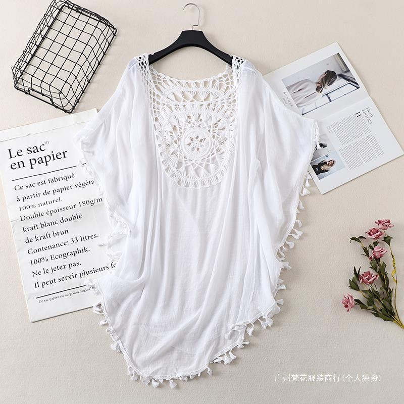 Cross-border new holiday hook solid color stitching European and American beach skirt small tassel sunscreen short sexy beach blouse