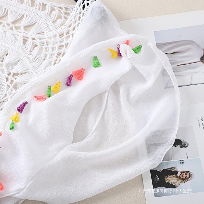 Cross-border new holiday hook solid color stitching European and American beach skirt small tassel sunscreen short sexy beach blouse