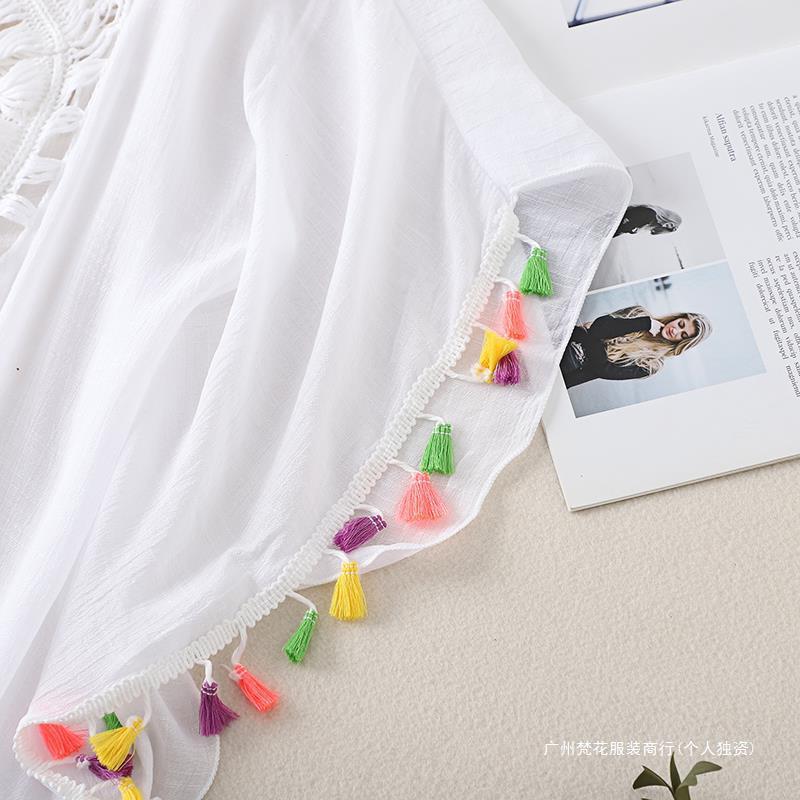 Cross-border new holiday hook solid color stitching European and American beach skirt small tassel sunscreen short sexy beach blouse