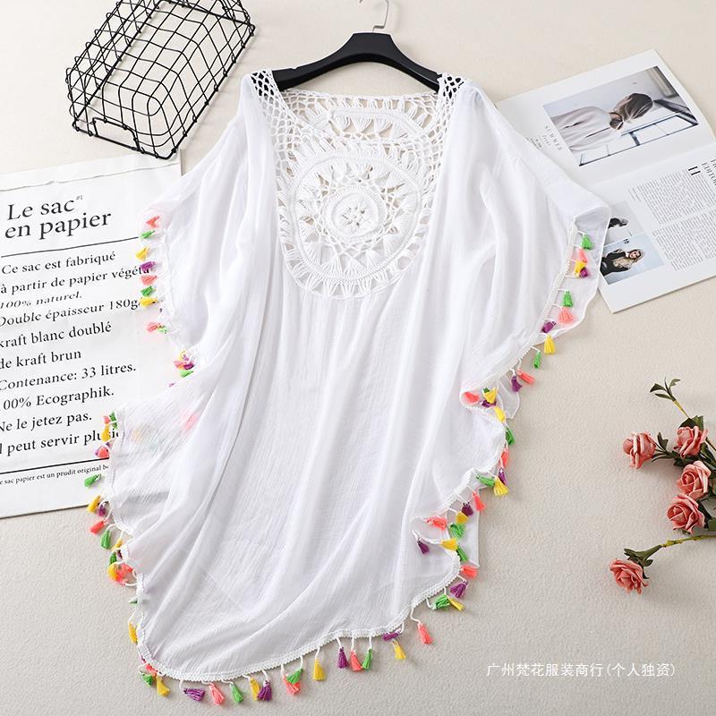 Cross-border new holiday hook solid color stitching European and American beach skirt small tassel sunscreen short sexy beach blouse