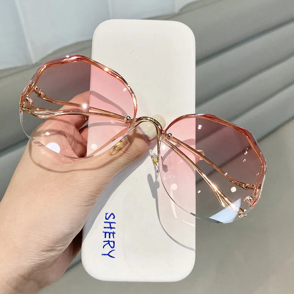 Women's Rimless Round Gradient Sunglasses 2026 New Trend UV400 Protection Anti Glare Metal Curved Temples Ocean Lens Eyewear