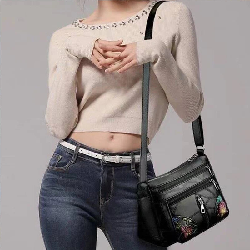 The lady's crossbody bag is made of PU material and features printed patterns, perfect for traveling and shopping.