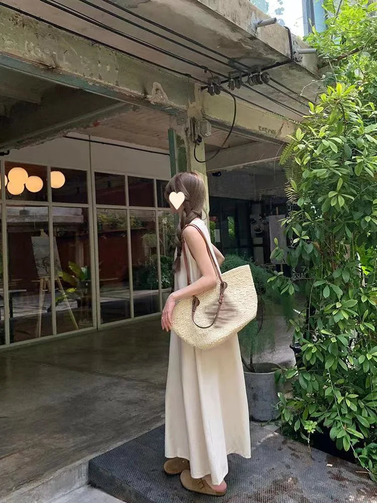 Korean-style elegant sleeveless spring dress for women, loose fit with hollow back design, round neck, long tank dress