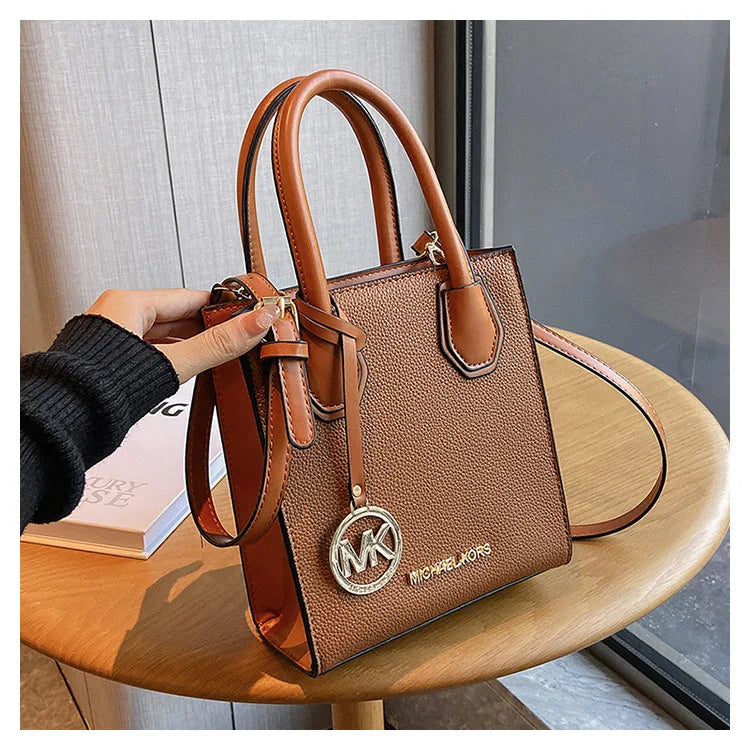 2026 New Michael Kors Women's Fashion One Shoulder Handbag MK Cross Shoulder Vertical Small Square Bag Classic Letter Bag