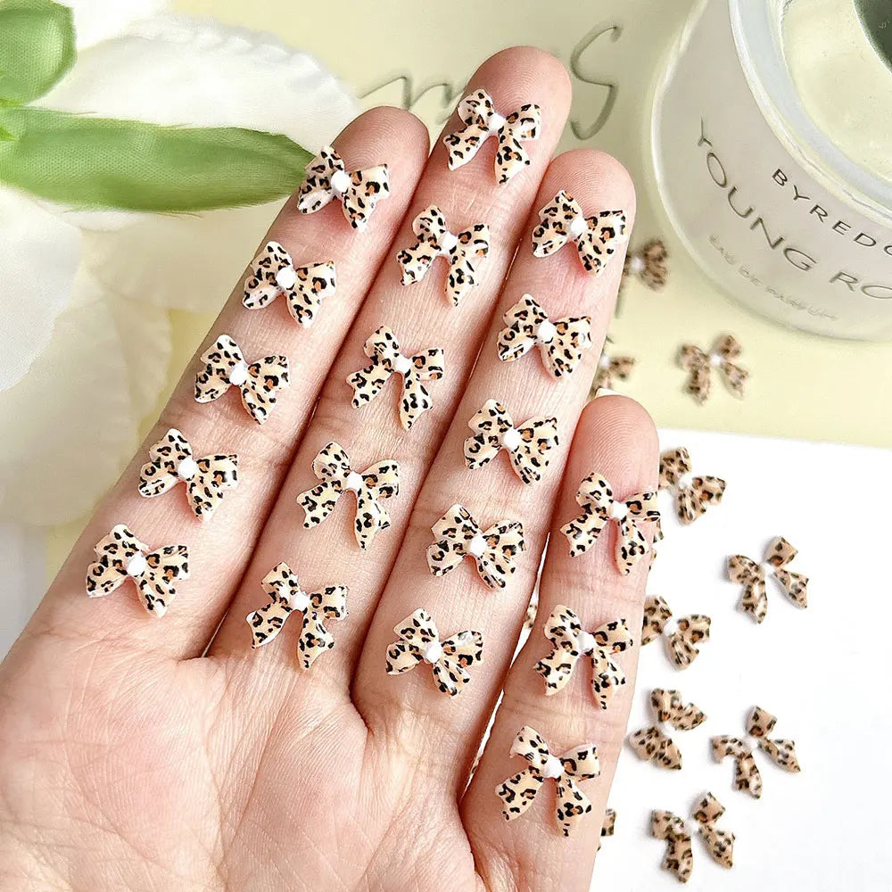 50pcs Leopard Print Bow Nail Art Decorations 10mm 3D Resin Leopard Ribbon Nail Charms Leopard Designs Acrylic Nail Art Supplies