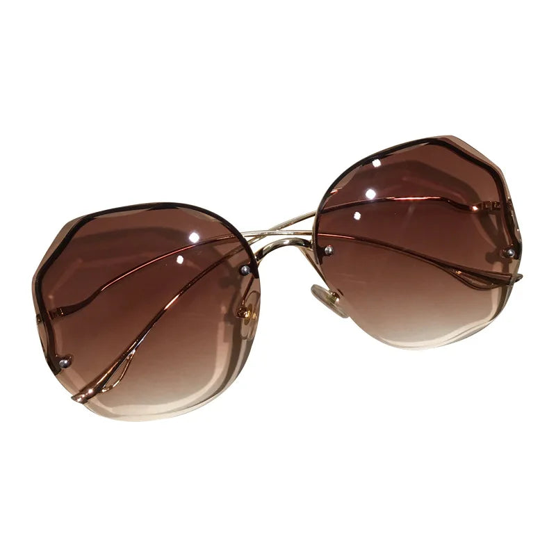 Women's Rimless Round Gradient Sunglasses 2026 New Trend UV400 Protection Anti Glare Metal Curved Temples Ocean Lens Eyewear