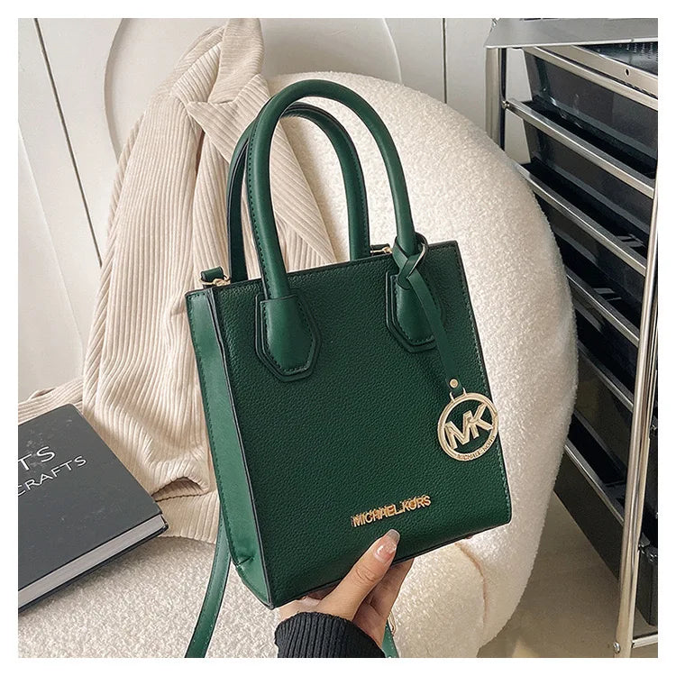 2026 New Michael Kors Women's Fashion One Shoulder Handbag MK Cross Shoulder Vertical Small Square Bag Classic Letter Bag