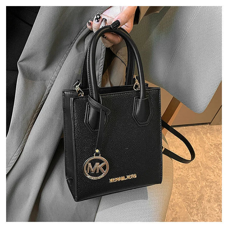 2026 New Michael Kors Women's Fashion One Shoulder Handbag MK Cross Shoulder Vertical Small Square Bag Classic Letter Bag