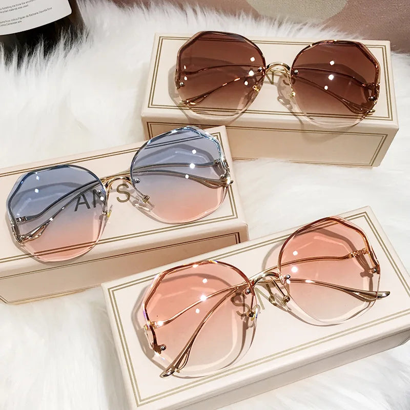 Women's Rimless Round Gradient Sunglasses 2026 New Trend UV400 Protection Anti Glare Metal Curved Temples Ocean Lens Eyewear