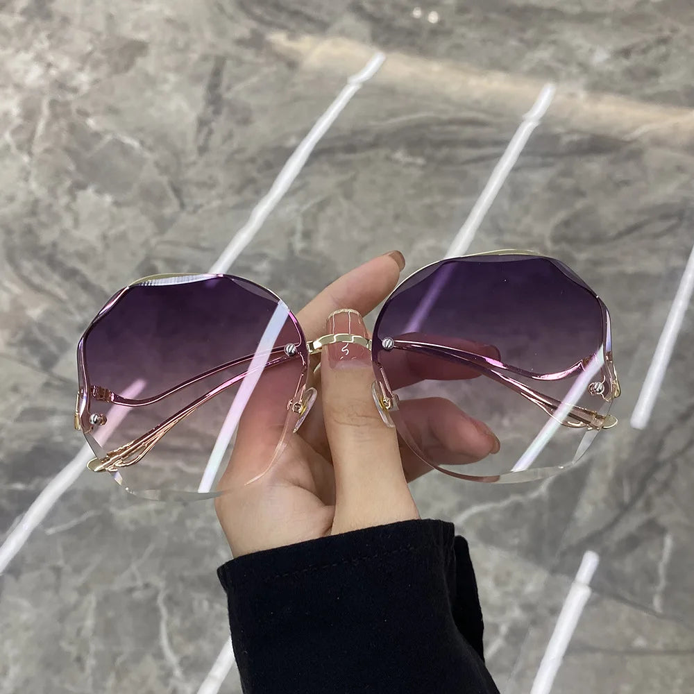 Women's Rimless Round Gradient Sunglasses 2026 New Trend UV400 Protection Anti Glare Metal Curved Temples Ocean Lens Eyewear
