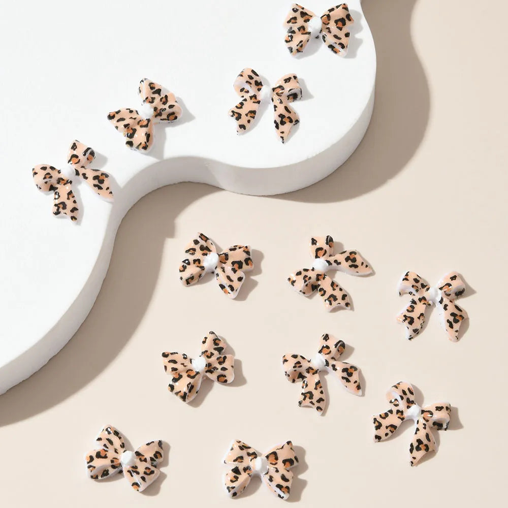 50pcs Leopard Print Bow Nail Art Decorations 10mm 3D Resin Leopard Ribbon Nail Charms Leopard Designs Acrylic Nail Art Supplies