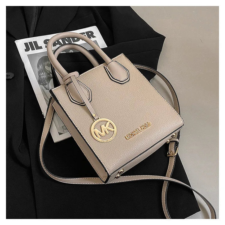2026 New Michael Kors Women's Fashion One Shoulder Handbag MK Cross Shoulder Vertical Small Square Bag Classic Letter Bag