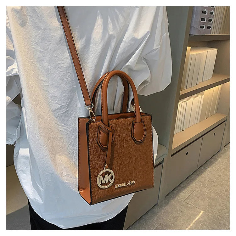 2026 New Michael Kors Women's Fashion One Shoulder Handbag MK Cross Shoulder Vertical Small Square Bag Classic Letter Bag
