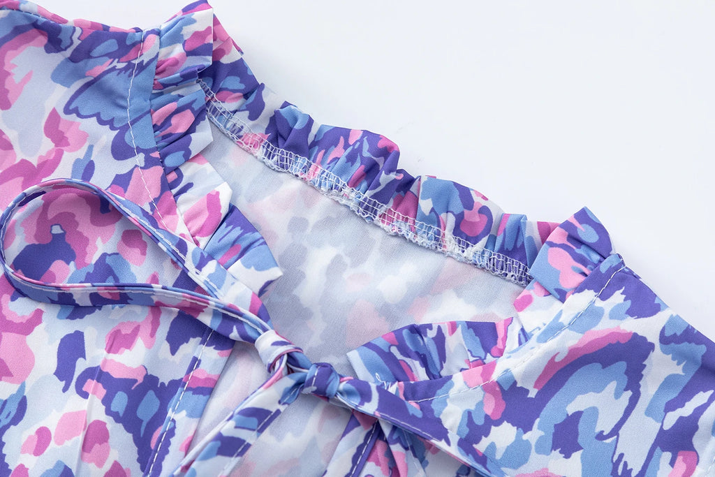 New European and American Summer Cross-border Seaside Vacation Mid to Long Sleeveless V-neck Tassel Abstract Print Dress