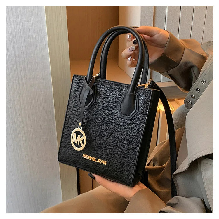 2026 New Michael Kors Women's Fashion One Shoulder Handbag MK Cross Shoulder Vertical Small Square Bag Classic Letter Bag