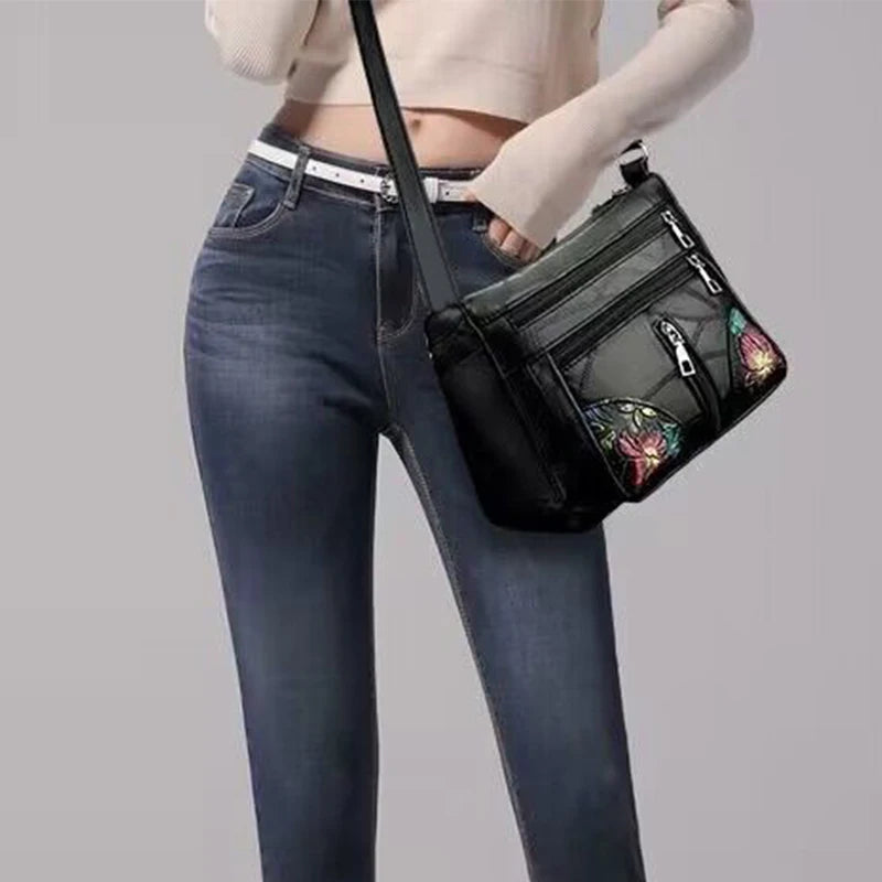 The lady's crossbody bag is made of PU material and features printed patterns, perfect for traveling and shopping.