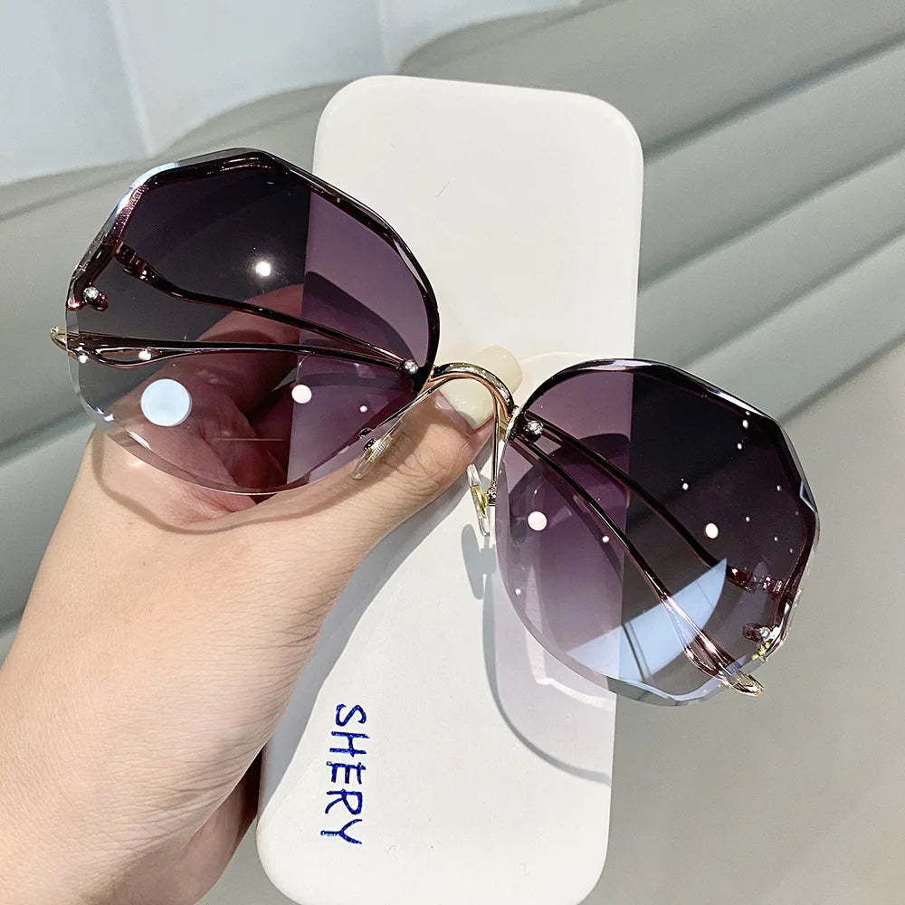 Women's Rimless Round Gradient Sunglasses 2026 New Trend UV400 Protection Anti Glare Metal Curved Temples Ocean Lens Eyewear