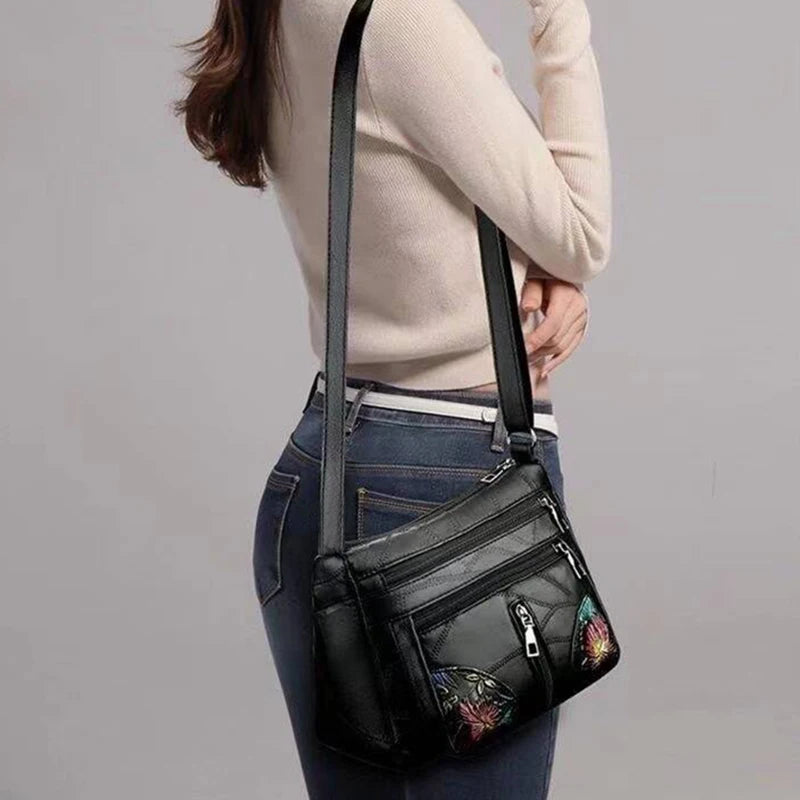 The lady's crossbody bag is made of PU material and features printed patterns, perfect for traveling and shopping.