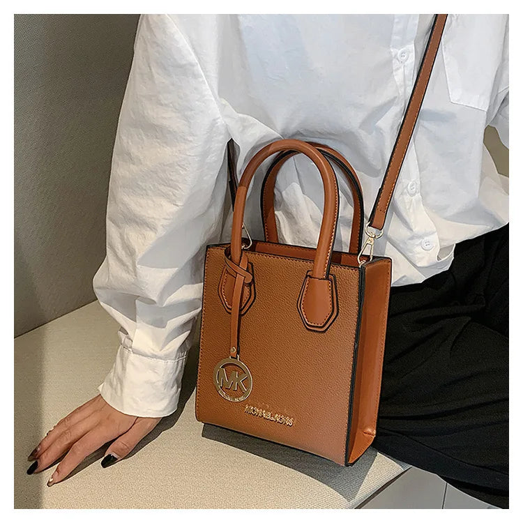 2026 New Michael Kors Women's Fashion One Shoulder Handbag MK Cross Shoulder Vertical Small Square Bag Classic Letter Bag
