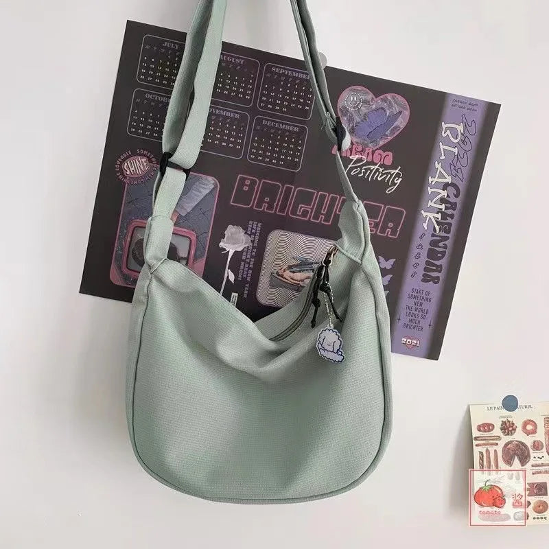 Canvas Crossbody Bag, Large Capacity Casual Shoulder Purse with Cute Bag Charm, Adjustable Strap for Teen School Sling Bag