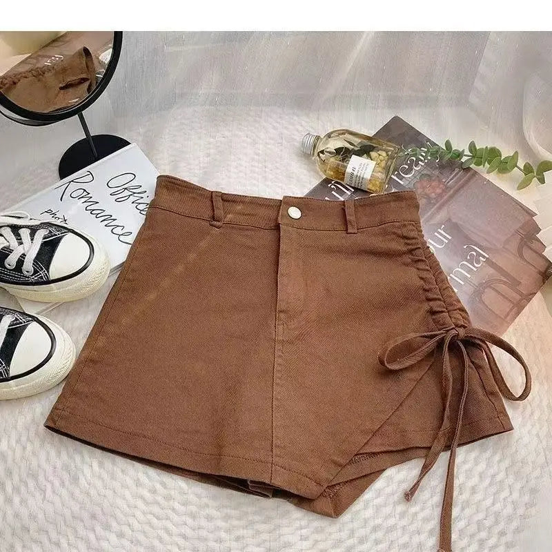 Korean style pink denim skirt female summer new design sense irregular drawstring casual fashion temperament slim A-line skirt.