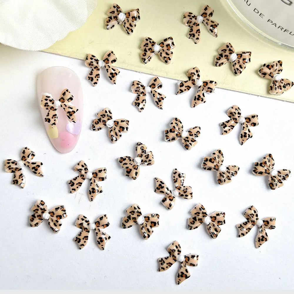 50pcs Leopard Print Bow Nail Art Decorations 10mm 3D Resin Leopard Ribbon Nail Charms Leopard Designs Acrylic Nail Art Supplies