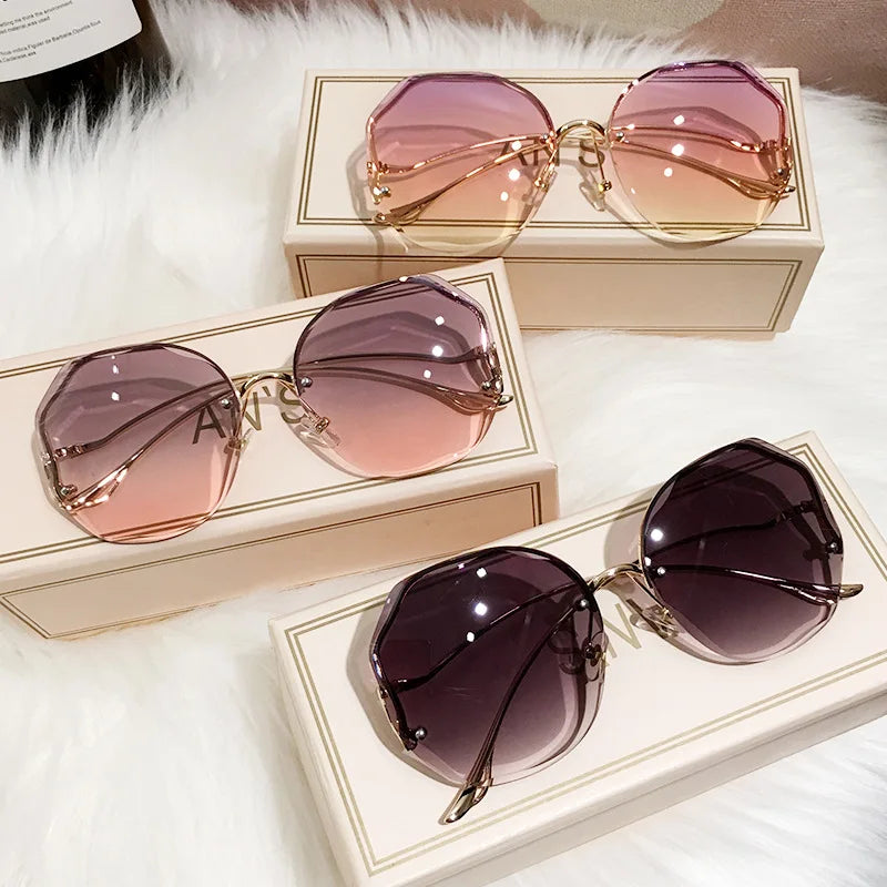 Women's Rimless Round Gradient Sunglasses 2026 New Trend UV400 Protection Anti Glare Metal Curved Temples Ocean Lens Eyewear