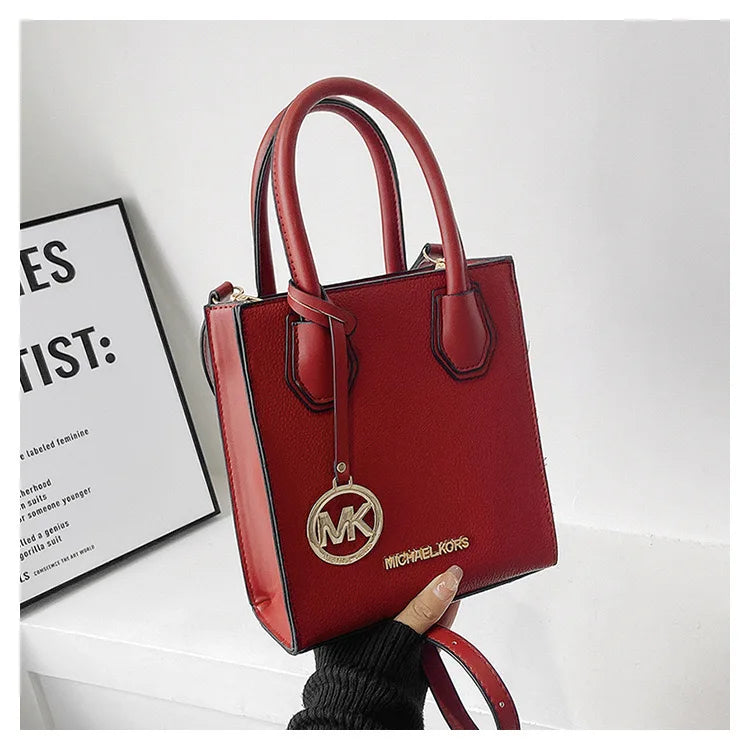 2026 New Michael Kors Women's Fashion One Shoulder Handbag MK Cross Shoulder Vertical Small Square Bag Classic Letter Bag