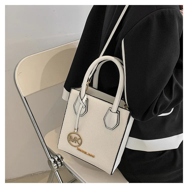 2026 New Michael Kors Women's Fashion One Shoulder Handbag MK Cross Shoulder Vertical Small Square Bag Classic Letter Bag