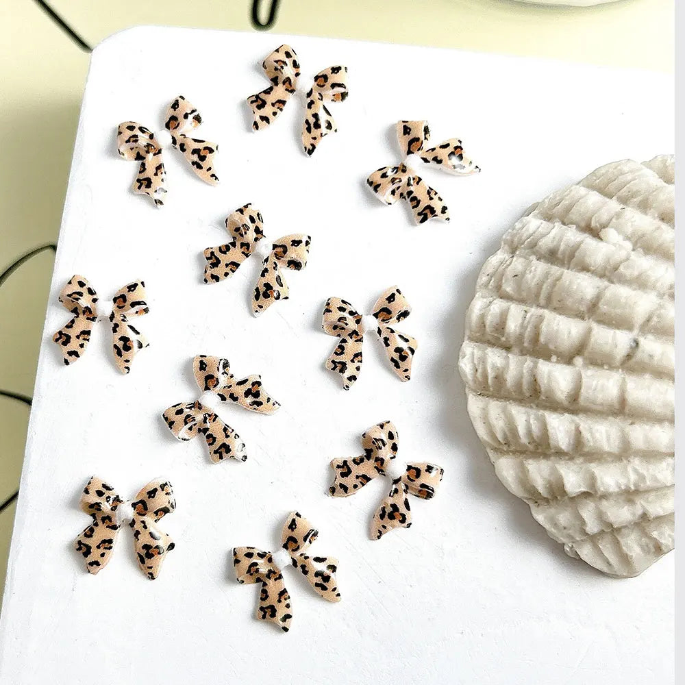 50pcs Leopard Print Bow Nail Art Decorations 10mm 3D Resin Leopard Ribbon Nail Charms Leopard Designs Acrylic Nail Art Supplies